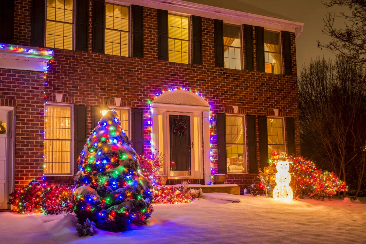 A home decorated with lighting for the holiday season in Falls Church