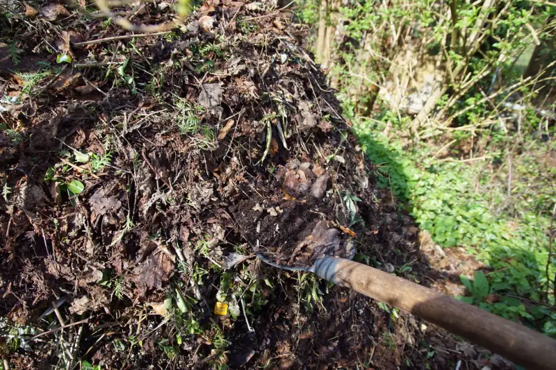Shovel in a compost pile