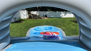Inflatable water slide in backyard