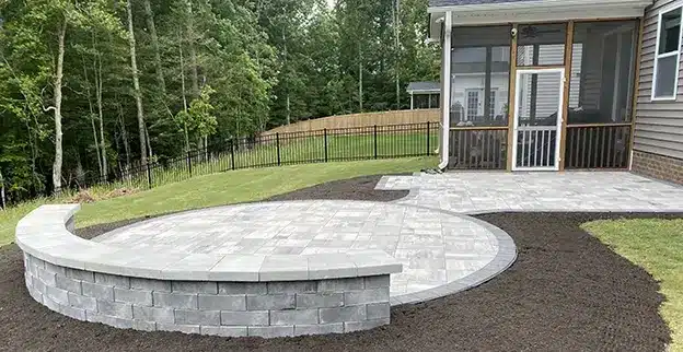 The Grounds Guys have completed hardscape installation in the backyard.