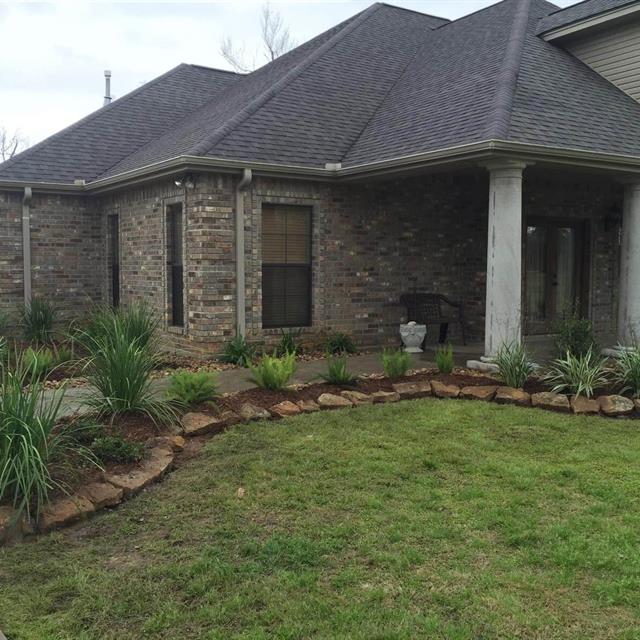 A beautiful house with a lawn and gardens