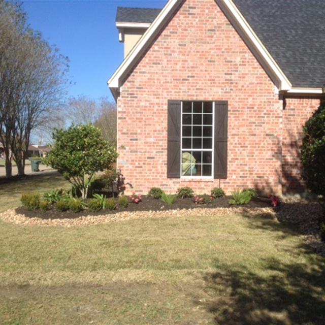 Brick House side view with grass yard