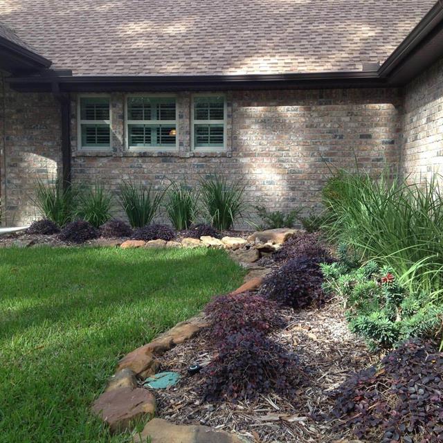 Brick House with grass yard and gardens