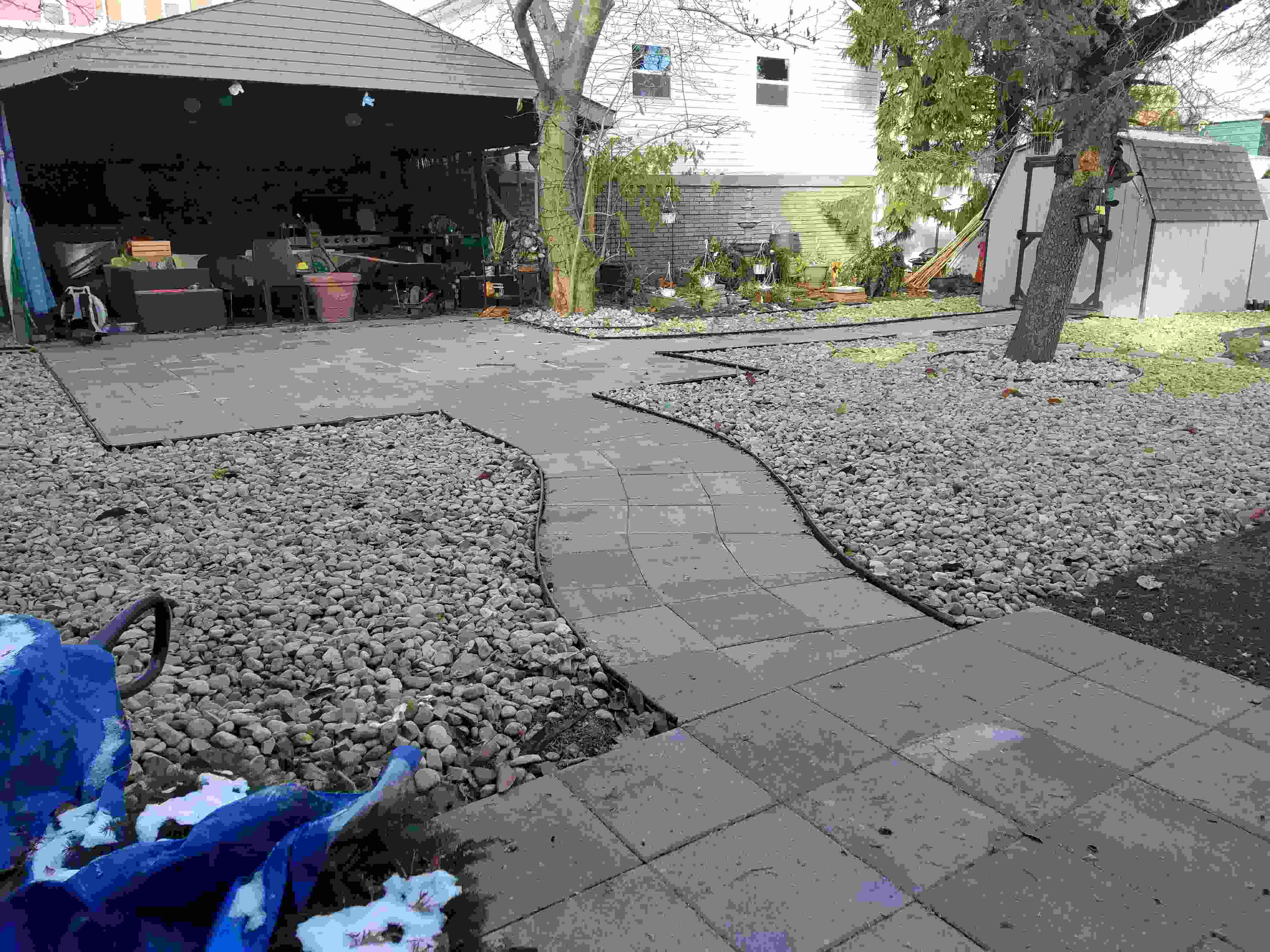 Brick path through gravel courtyard