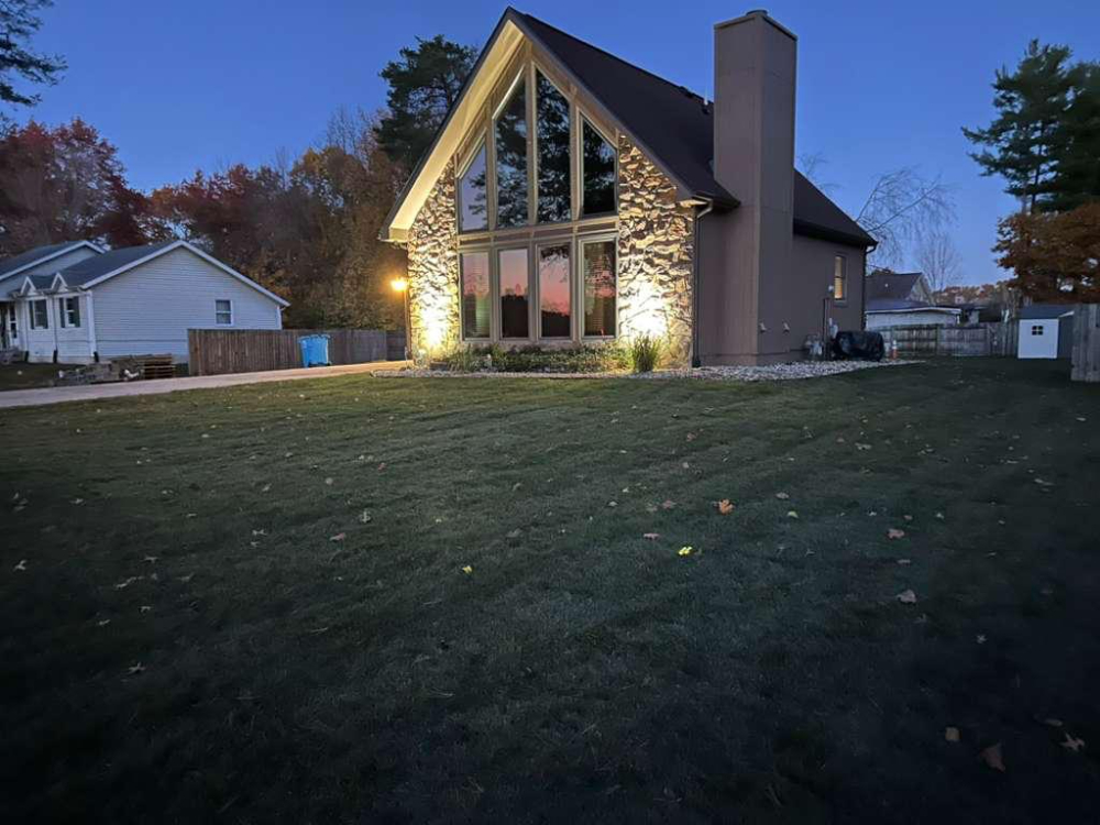 New lawn at dusk with freshly installed sod
