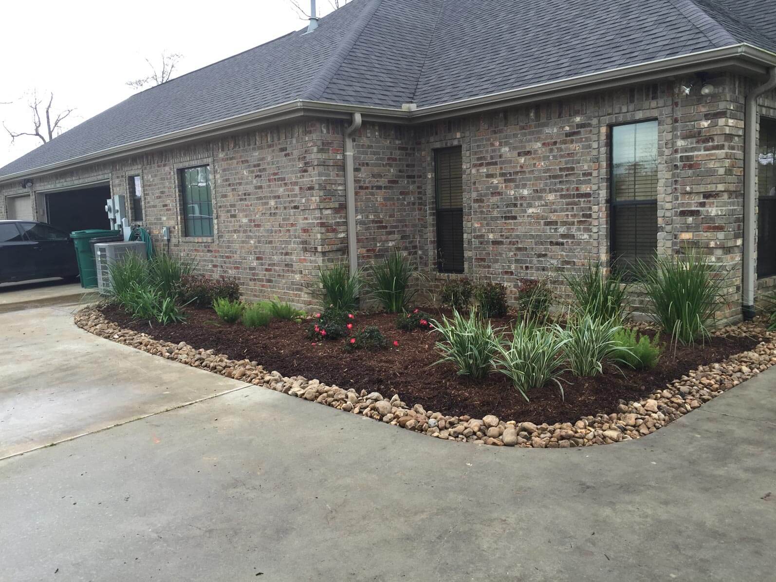 Soil and stone landscape in front of  stone house