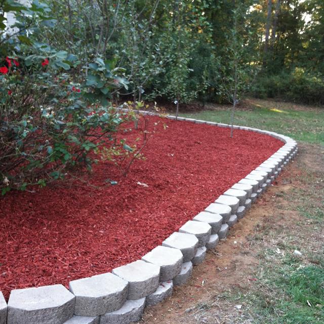 new landscaped garden with a white stone border