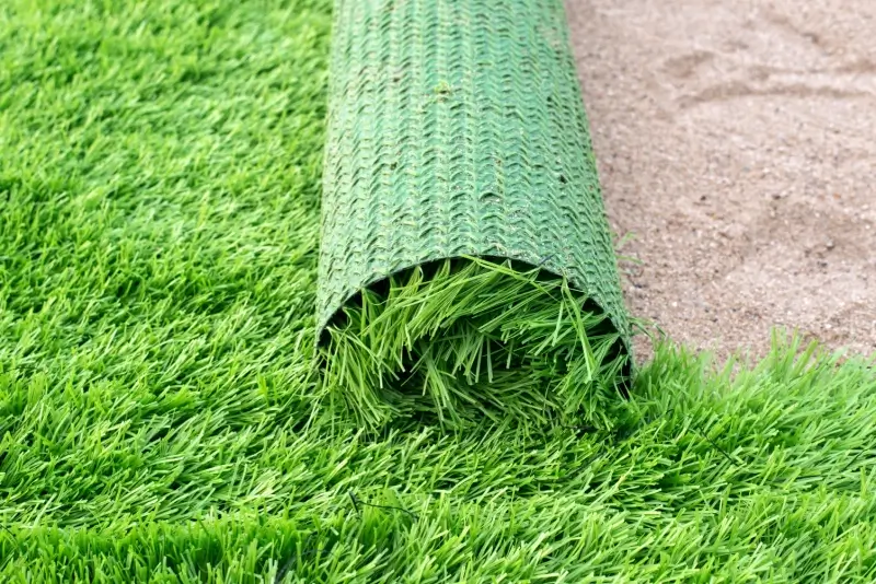 Roll of artificial turf on commercial property.