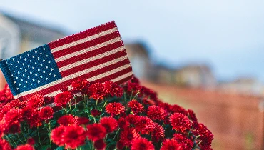 Small American flag in flower pot | The Grounds Guys of Gettysburg