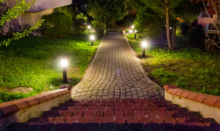 Steps leading down to lit pathway