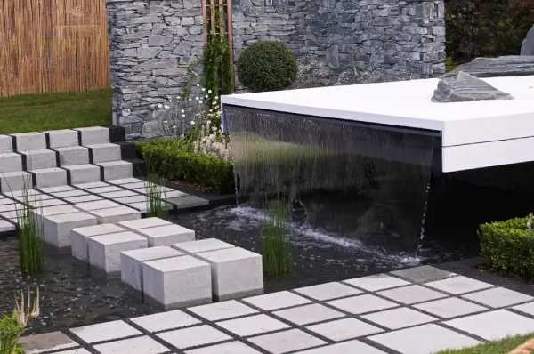 Modern water feature in residential back yard.