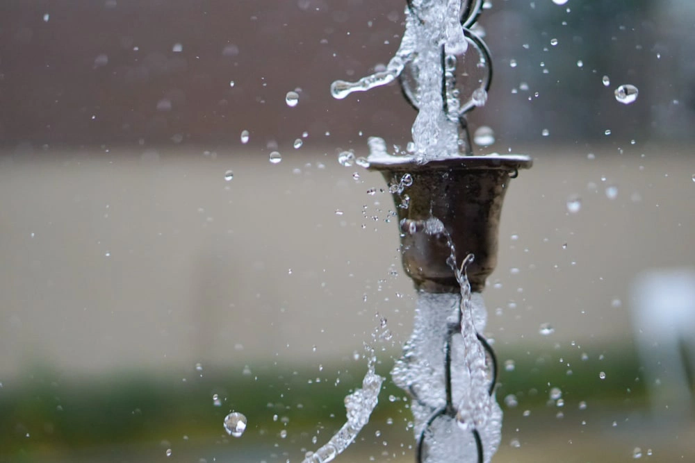 Water flowing through rain chain