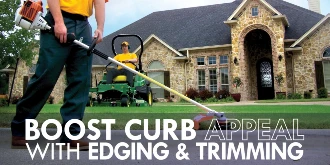 The Grounds Guys employees with text: "Boost curb appeal with edging & trimming"