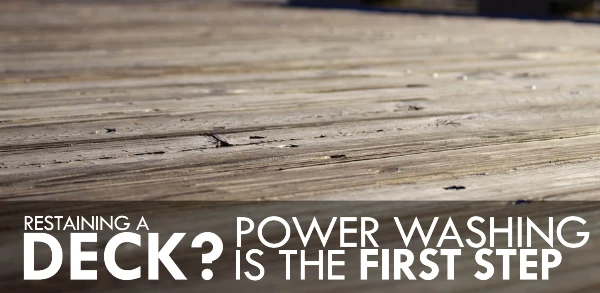 Deck with text: "Restaining a deck: Power washing is the first step"