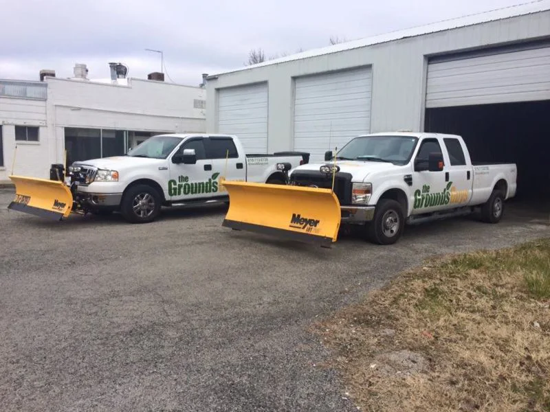 Grounds Guys trucks for salt and sanding services 