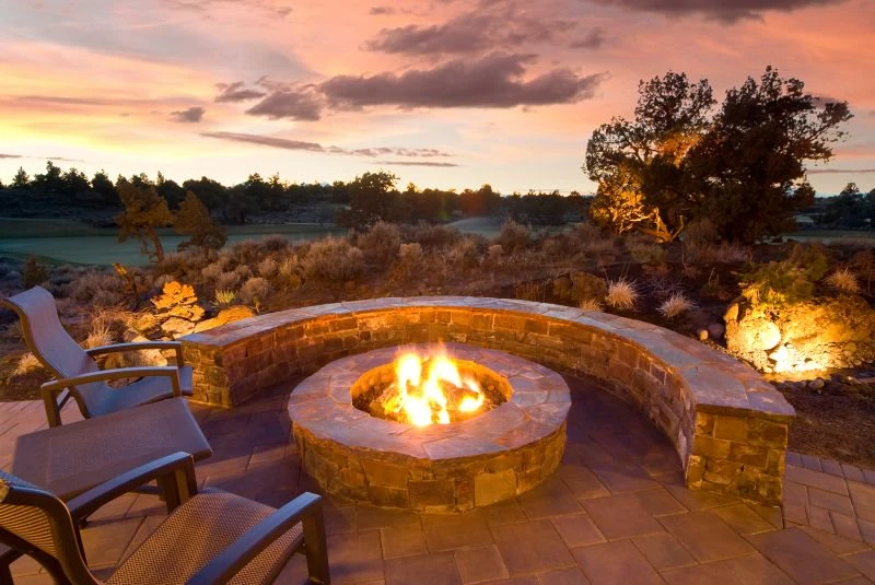 Outdoor hardscape fireplace design by The Grounds Guys.