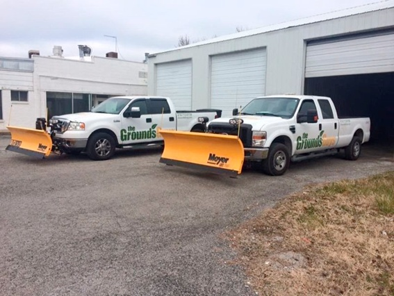Grounds Guys trucks outside garage prepared for commercial snow clearing