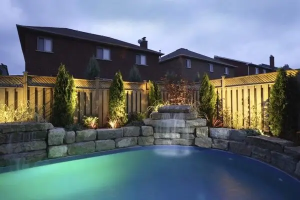 Grounds Guys landscape lighting installed around pool