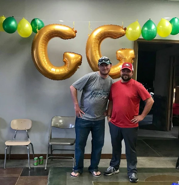 Two men in front of GG Balloon