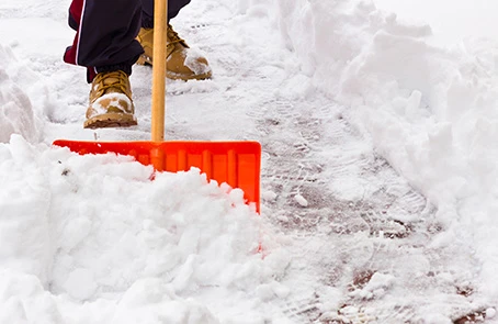 Ground Guys shoveling snow.